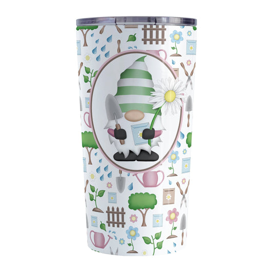 Spring Gnome Gardening Pattern Tumbler Cup (20oz) at Amy's Coffee Mugs. A stainless steel tumbler cup designed with an adorable spring gardening gnome holding an oversized daisy in a white oval over a springtime gardening pattern with trees, plants, flowers, seed packets, watering cans, fences, and gardening tools in spring colors such as pink, blue, green, and brown. 