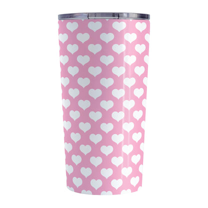 White Hearts Pattern Pink Tumbler Cup (20oz, stainless steel insulated) at Amy's Coffee Mugs. A tumbler cup designed with white hearts in a polka-dotted style pattern over a pink background color that wraps around the cup.