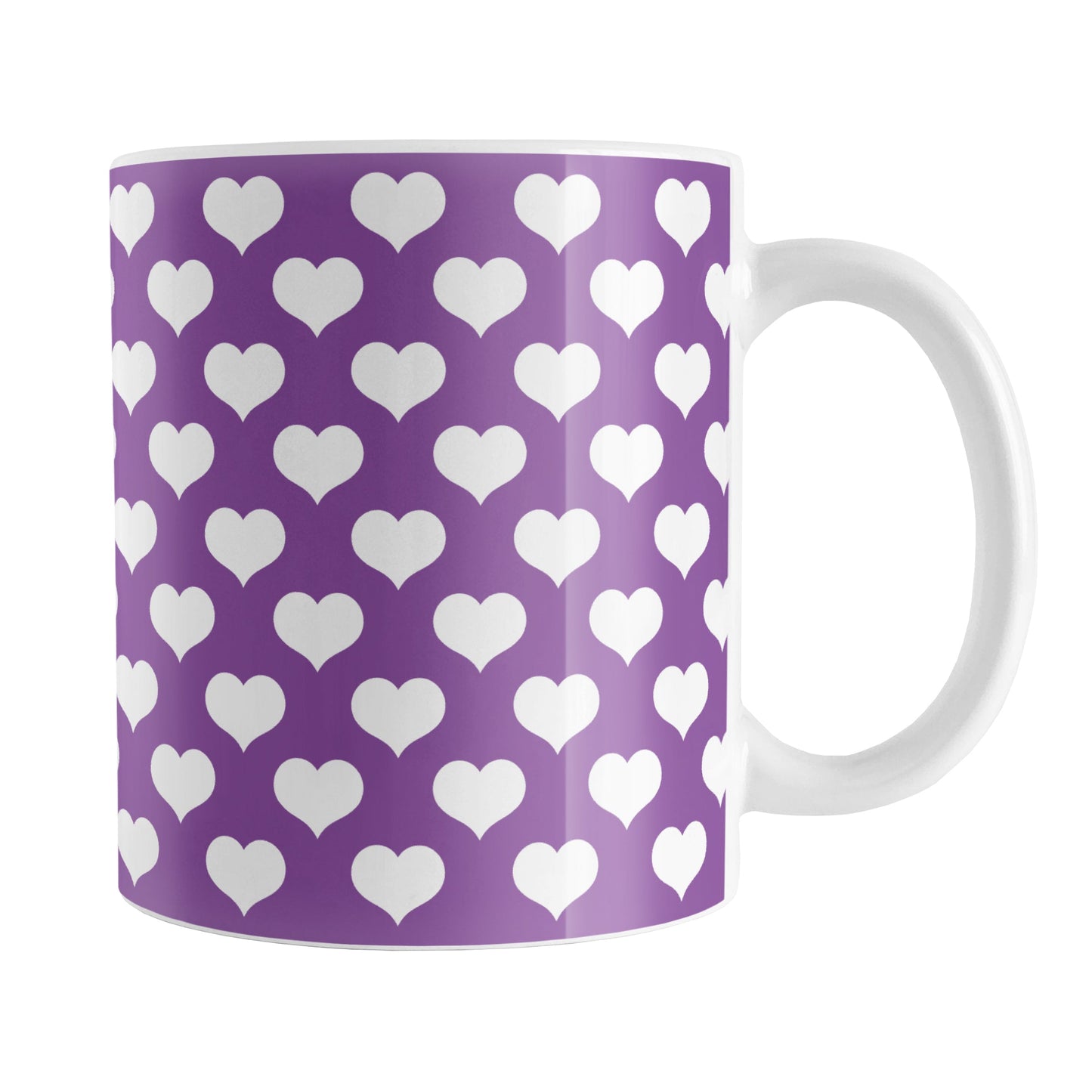 White Hearts Pattern Purple Mug (11oz) at Amy's Coffee Mugs. A ceramic coffee mug designed with white hearts in a polka-dotted style pattern over a purple background color that wraps around the mug up to the handle.