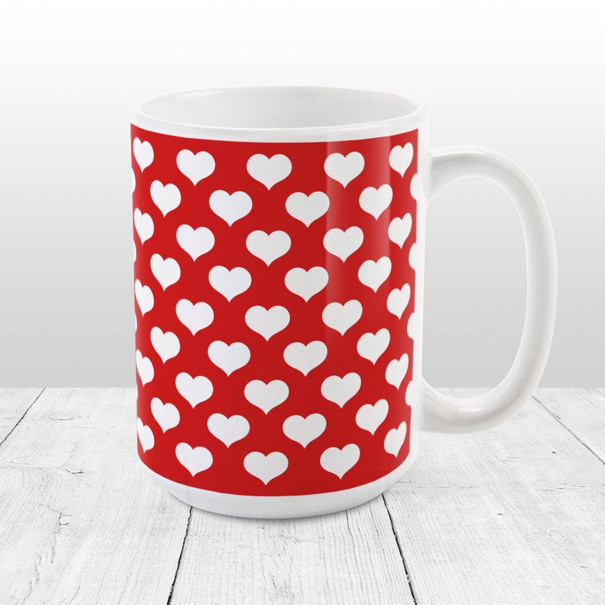 White Hearts Pattern Red Mug at Amy's Coffee Mugs. A ceramic coffee mug designed with a pattern of big white hearts over a red background color that wraps around the mug to the handle. It's the perfect mug for anyone who loves hearts and the color red.