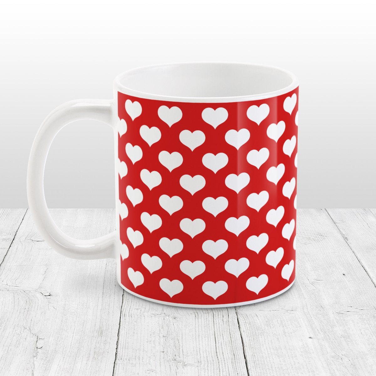 White Hearts Pattern Red Mug at Amy's Coffee Mugs. A ceramic coffee mug designed with a pattern of big white hearts over a red background color that wraps around the mug to the handle. It's the perfect mug for anyone who loves hearts and the color red.