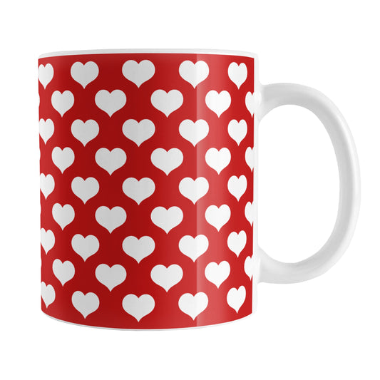 White Hearts Pattern Red Mug (11oz) at Amy's Coffee Mugs. A ceramic coffee mug designed with a pattern of big white hearts over a red background color that wraps around the mug to the handle. It's the perfect mug for anyone who loves hearts and the color red.