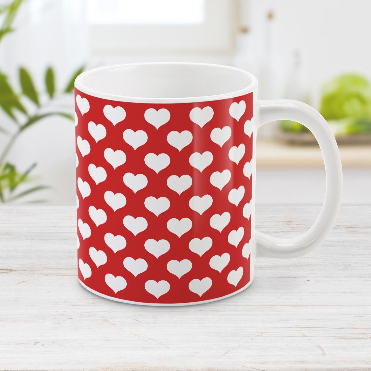 White Hearts Pattern Red Mug at Amy's Coffee Mugs. A ceramic coffee mug designed with a pattern of big white hearts over a red background color that wraps around the mug to the handle. It's the perfect mug for anyone who loves hearts and the color red.